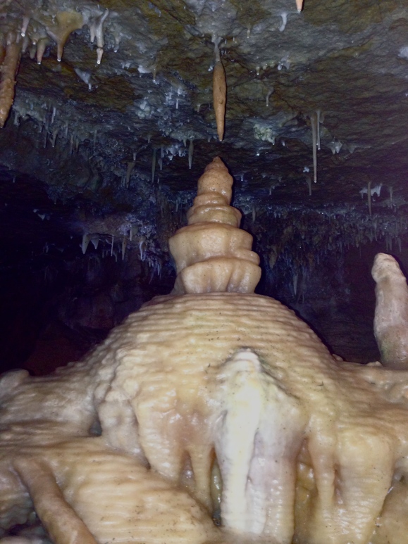 A stalagmite reaches up to a stalactite.